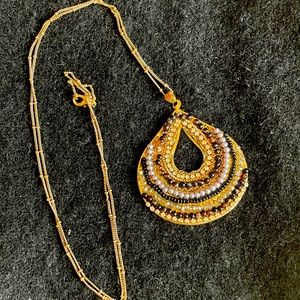 Necklace with multi stone pendant